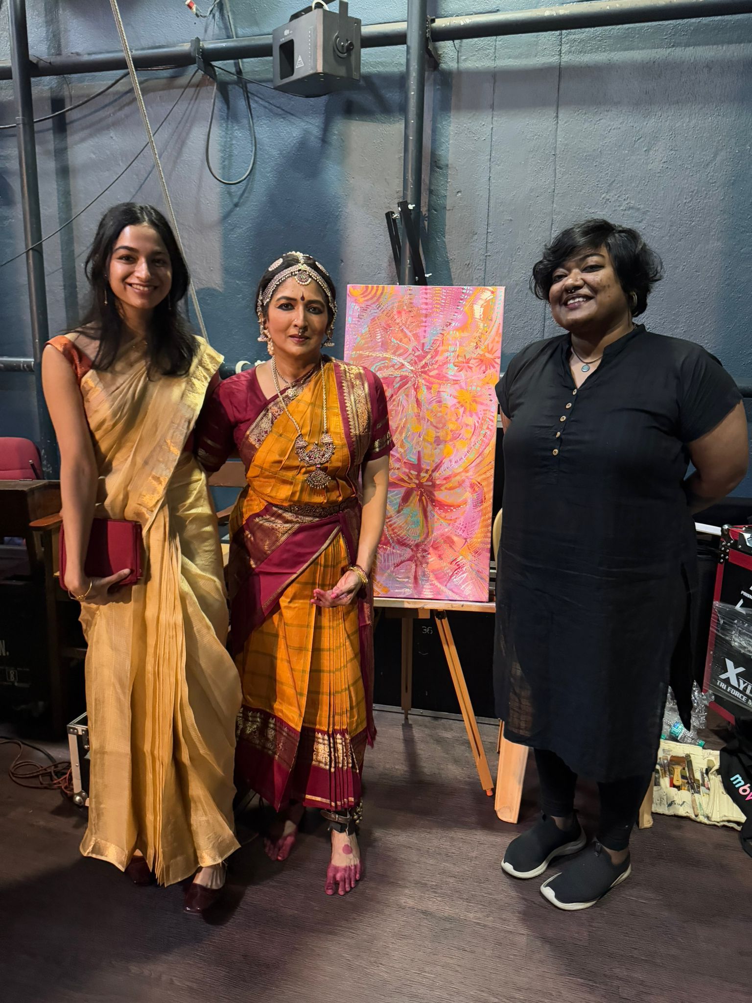 Rhea Fabian with Dr Srinidhi Chidambaram and the completed live painting after the recital.